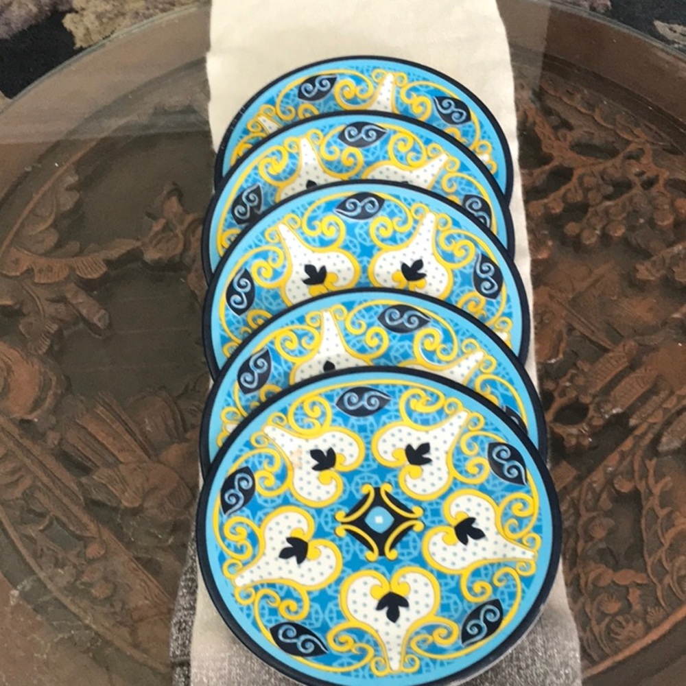 Pretty little plates by Avon. 9” around